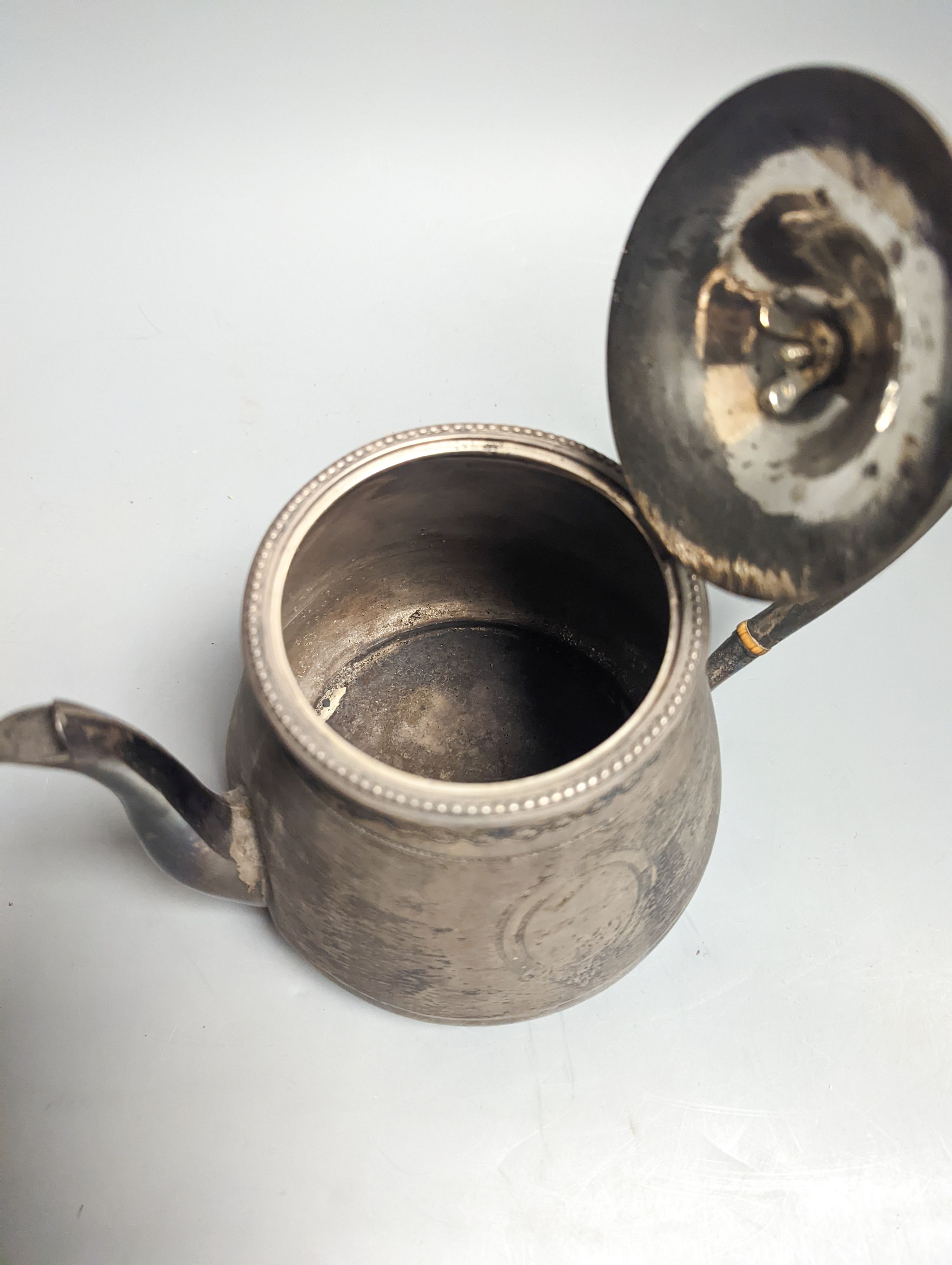 A Victorian engraved silver teapot, by Robert Hennell III, London, 1864, gross weight 19oz.